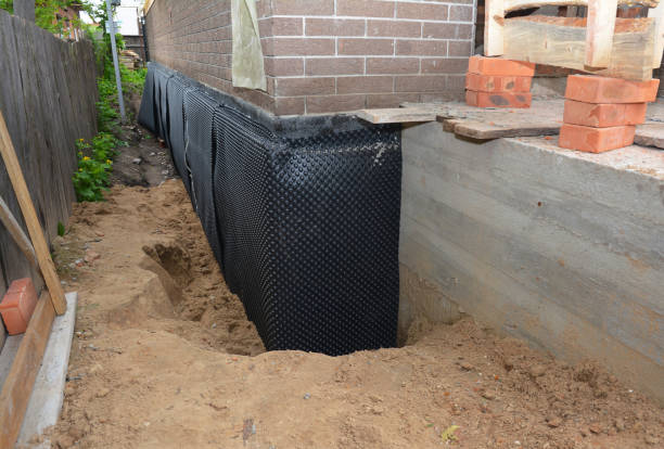 Happy homeowners after waterproofing job in Chicago